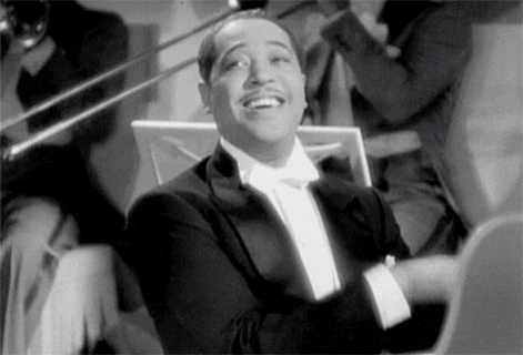 Duke Ellington smiling at the piano