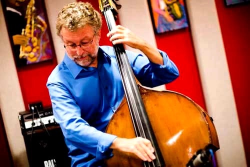 Bassist performing with a band