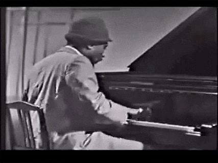Pianist performing at the piano