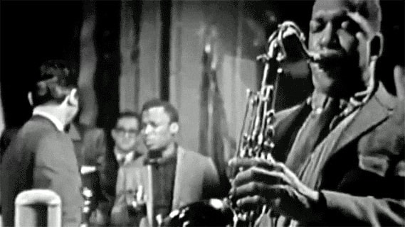 Saxophone player performing with a band