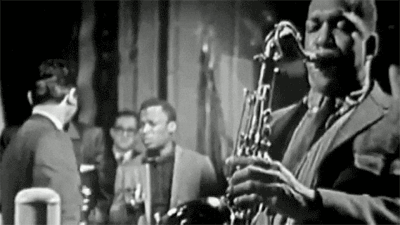 Saxophonist performing in black and white